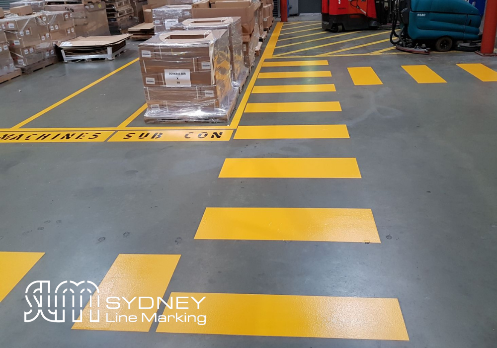Yellow Pedestrian crossing in a warehouse by Sydney Line Marking